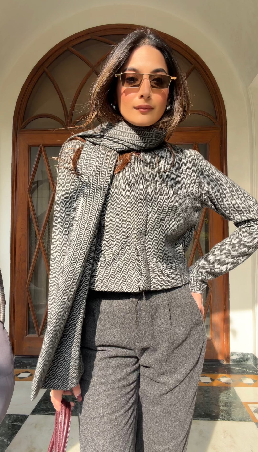 Itika Arora in Nova herringbone scarf-coat