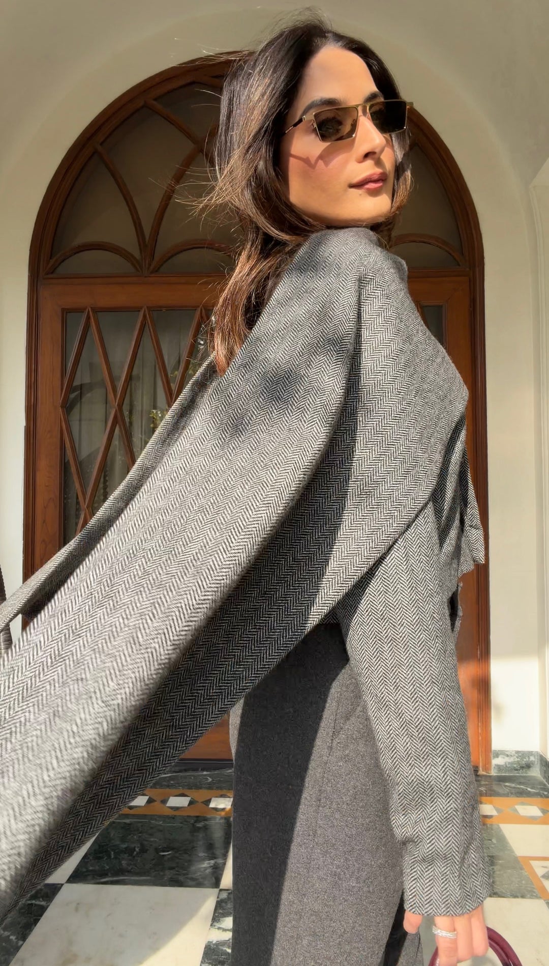 Itika Arora in Nova herringbone scarf-coat