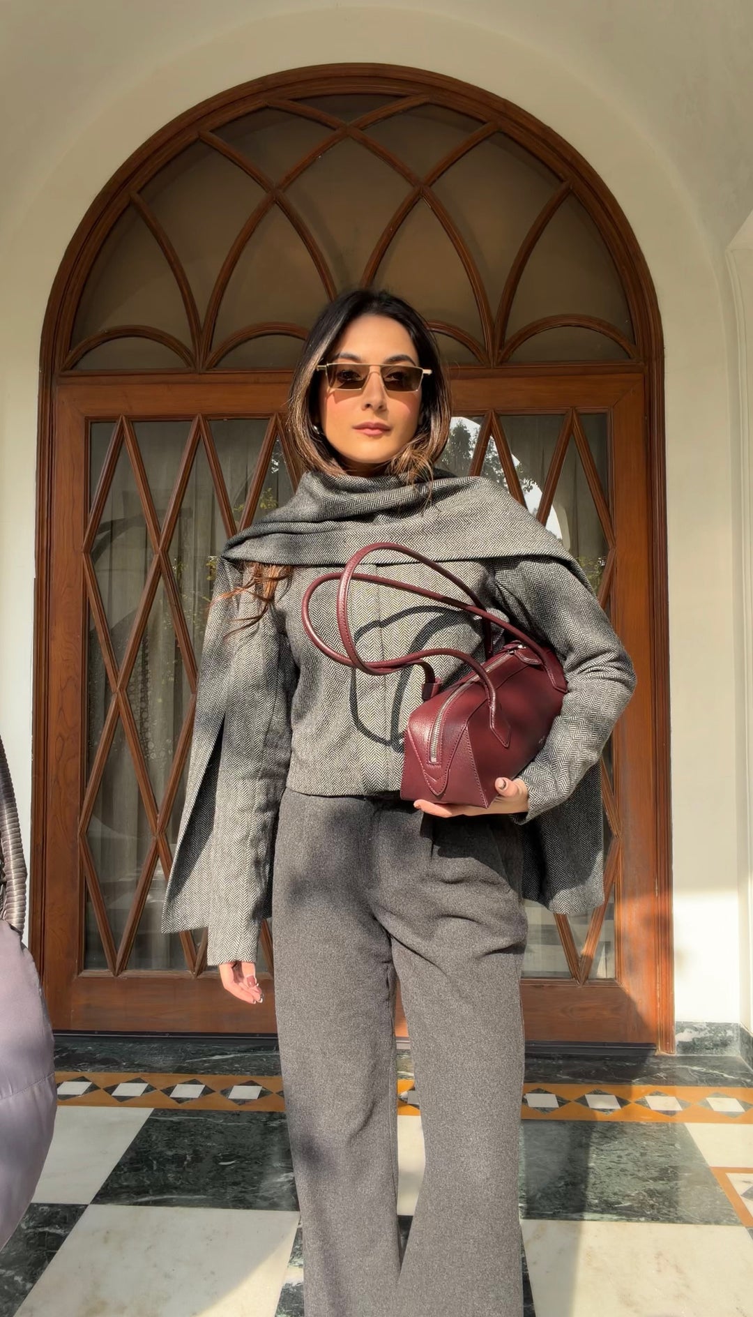 Itika Arora in Nova herringbone scarf-coat